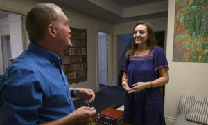 Erica Issenberg speaking to professor in lab