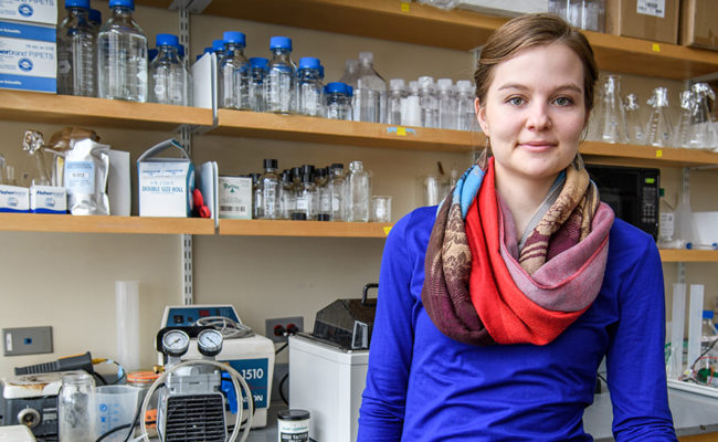 Emily Dart stands in lab