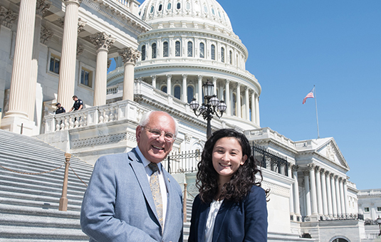 Student in front of Capitol