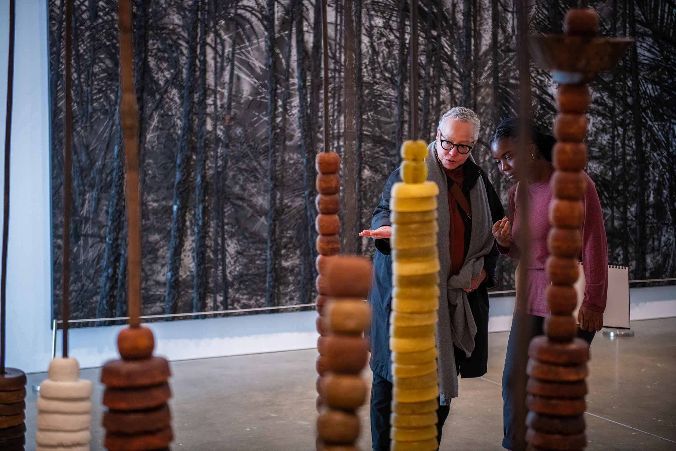 Professor Toby Sisson discussing a sculpture with a student during a trip to the ICA, Boston