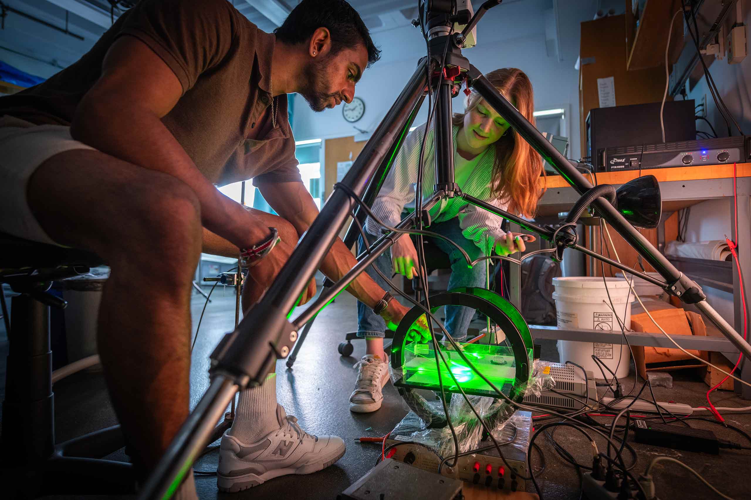 Students working on an elastic robotics project in the physics lab