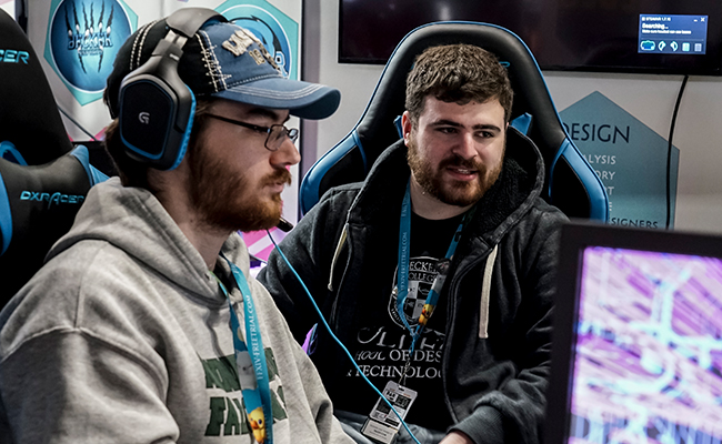 two males looking over gaming section